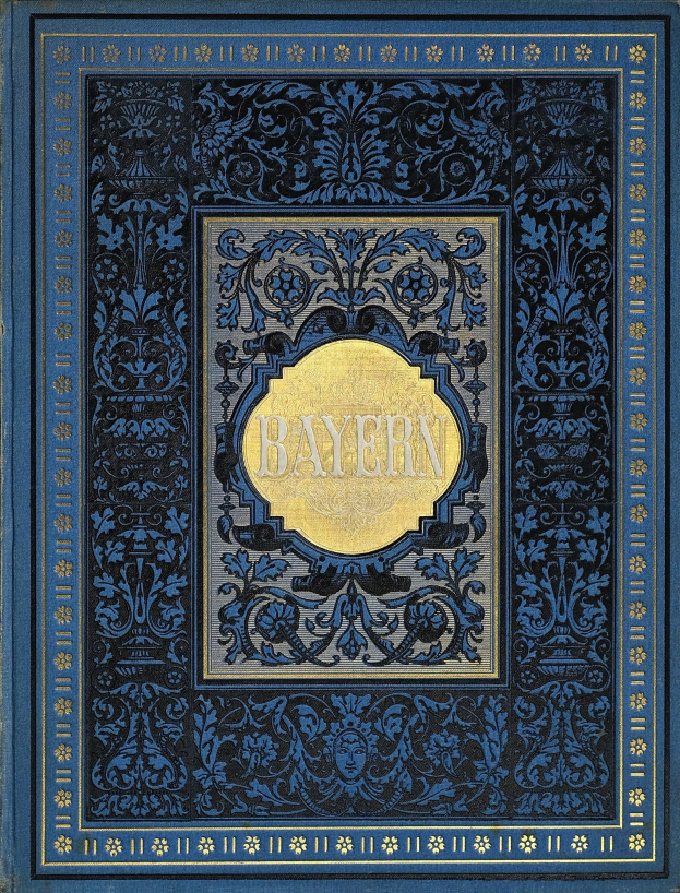 Ein blau-goldenes Buch mit dem Wort "Bayern" auf dem Cover, das mit detaillierten Verzierungen versehen ist.