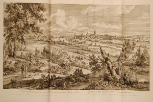 Offenes Buch mit der Aufschrift 'Ansicht der Schlacht von Castellum und Castellium aus der Illustrated London News' mit einer detaillierten Landschaftsillustration mit Menschen in der Vordergrund, Bäumen, Pflanzen, Gebäuden im Hintergrund und Wolken am Himmel.