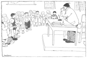 Ein Mann sitzt an einem Schreibtisch mit Büchern und Gegenständen vor einer Gruppe von Kindern, mit Papieren an der Wand hinter ihm, was darauf hindeutet, dass er wahrscheinlich ein Lehrer ist.