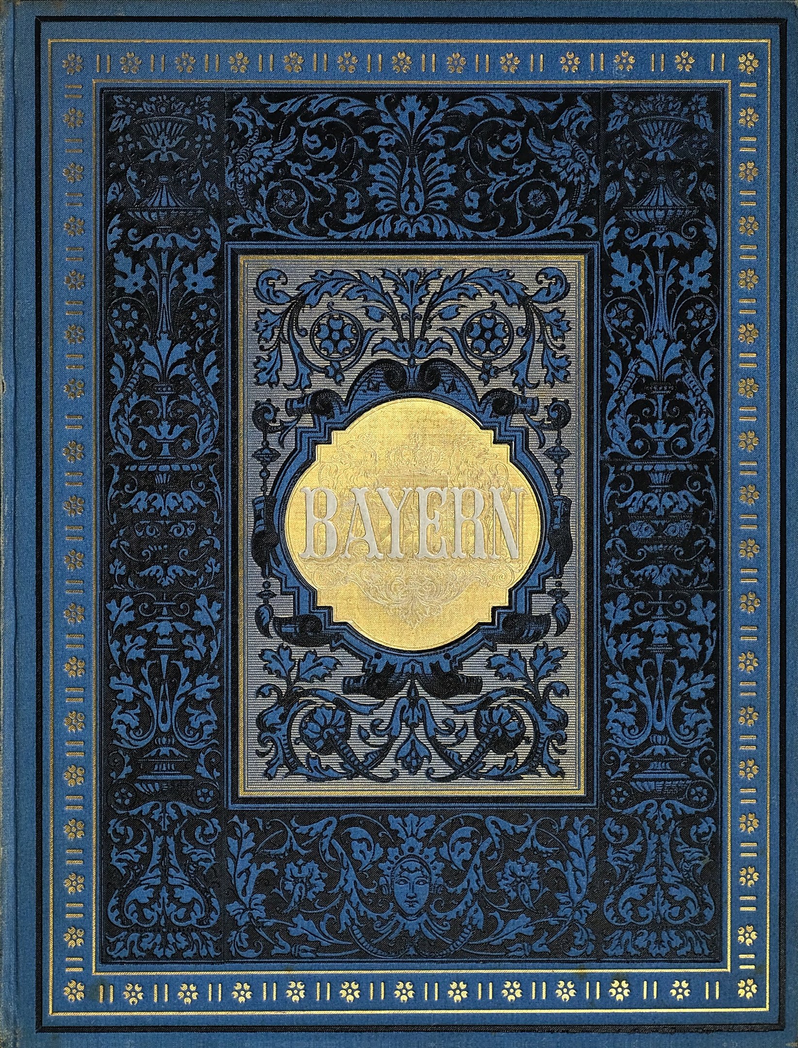 Ein blau-goldenes Buch mit der Aufschrift 'Bayern' auf dem Cover, das mit detaillierten Dekordesigns versehen ist.